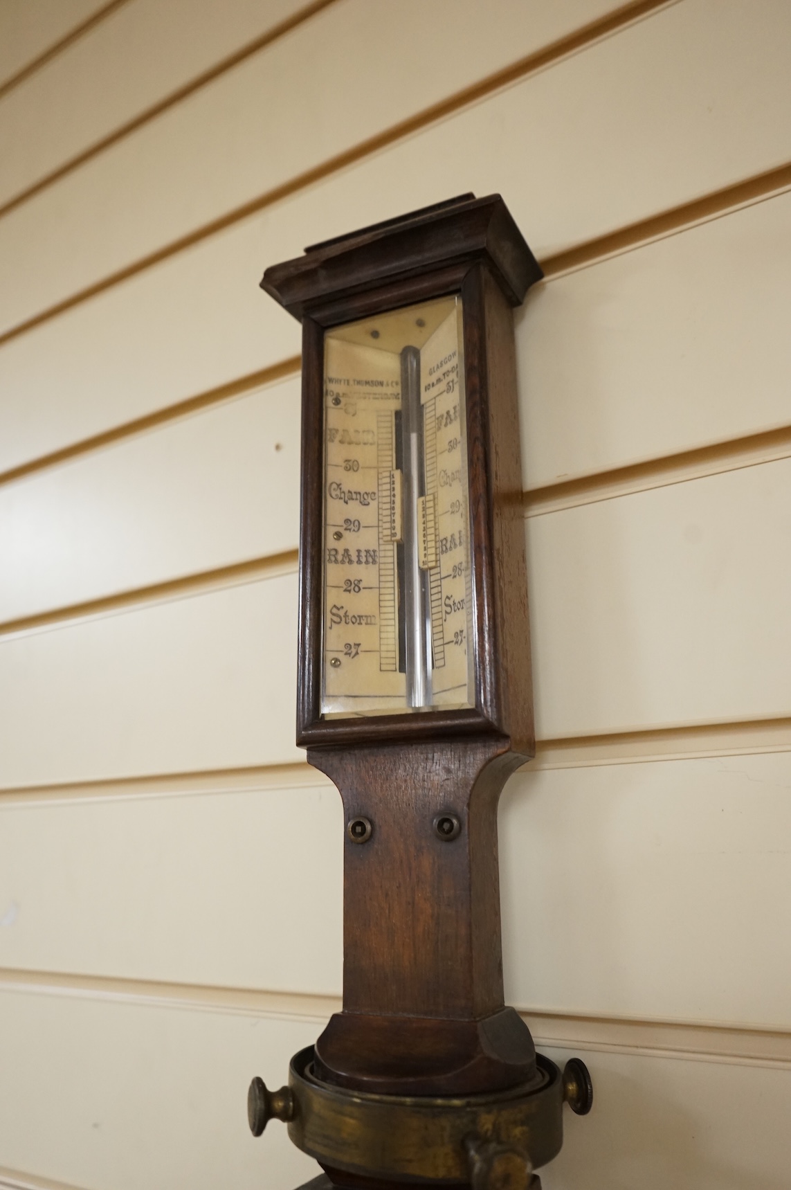 A 19th century oak marine stick barometer by Whyte Thomson, Glasgow, with ‘improved sympiesometer’ and thermometer to the front, with part of the brass gimbal holder still present, 96cm high, CITES Submission reference Y